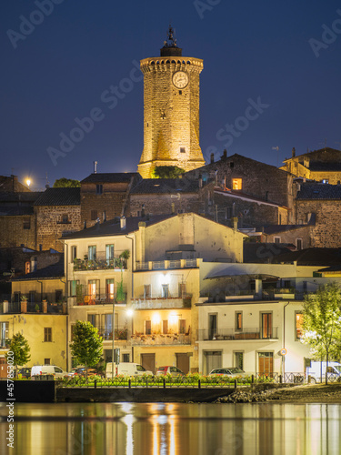 golden lights on the tower with clock in city Marta on lake Bolsena in Italy