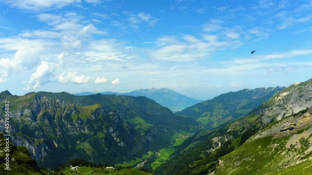 Helicopter flies over the Swiss Alps. Helicopter flies over the Swiss Alps.