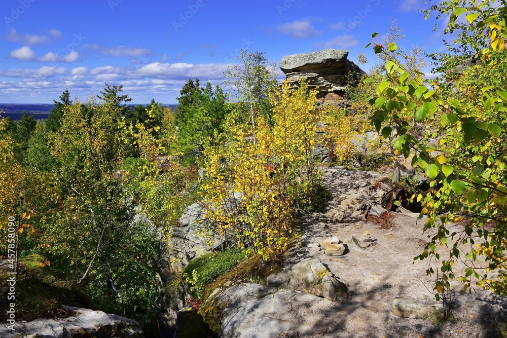 A plateau of sandstone megaliths and the Feathered Guardian rock in the Kamenny Gorod tract A plateau of sandstone megaliths and the Feathered Guardian rock in the Kamenny Gorod tract