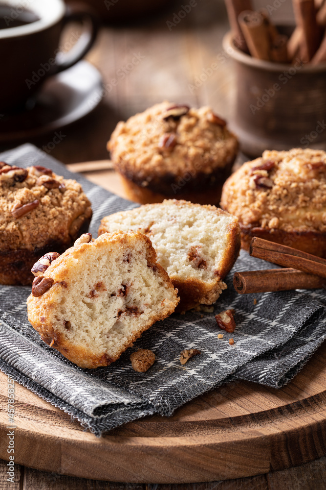 Fototapeta premium Cinnamon streusel nut muffins on a wooden platter
