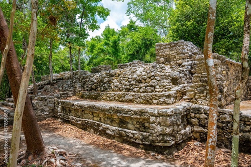 Nohoch Mul Pyramid in Coba. Pyramid and temple with stone steps in the Maya ruins of Coba photo