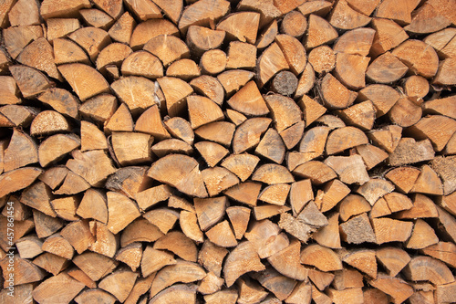 wall firewood   Background of dry chopped firewood logs in a pile