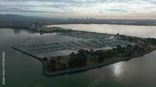 Aerial: Emeryville Marina and Oakland city skyline. California, USA photo