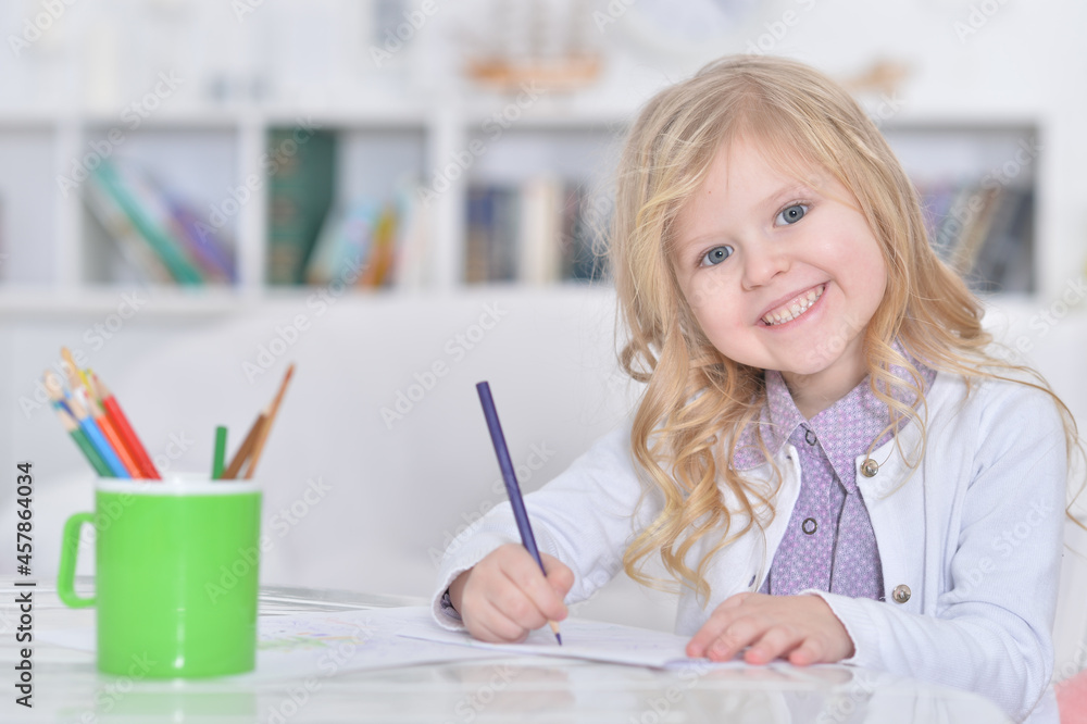 Portrait of smiling girl drawing at home Portrait of smiling girl drawing at home