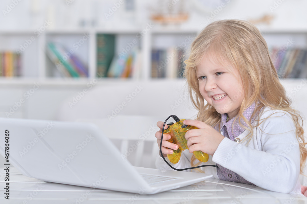Portrait of cute emotional cute girl using laptop Portrait of cute emotional cute girl using laptop
