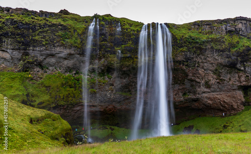 dramatic photo of Seljalandsfoss  waterfall  situated on the South Coast of Iceland close to the Ring Road.