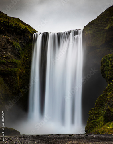 breath taking powerful Skogafoss waterfall  along route 1 in Iceland during summer.