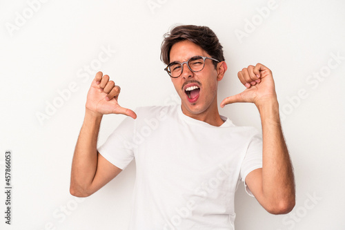 Young mixed race man isolated on white background feels proud and self confident, example to follow.