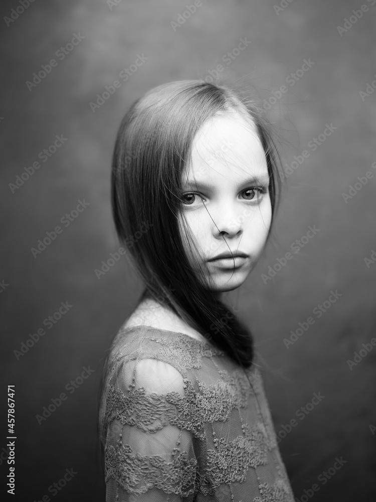 portrait of a little girl close-up posing black and white photo