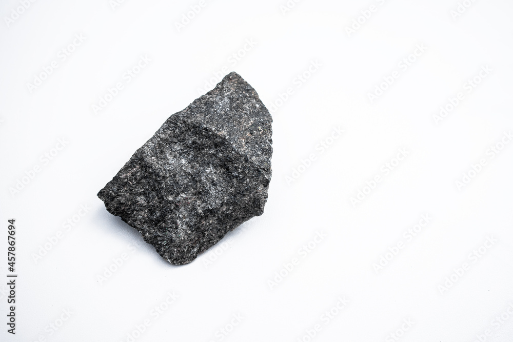Black granite stone on a white isolate. Black granite stone on a white isolate.