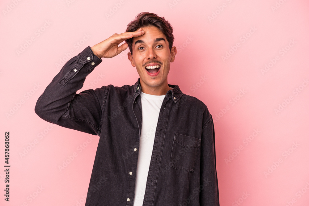 Young mixed race man isolated on white background shouts loud, keeps eyes opened and hands tense. Young mixed race man isolated on white background shouts loud, keeps eyes opened and hands tense.