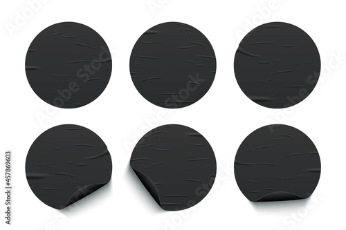 Glued round black stickers set isolated on white background. Vector realistic crumpled posters bundle. Empty advertising circles mockup