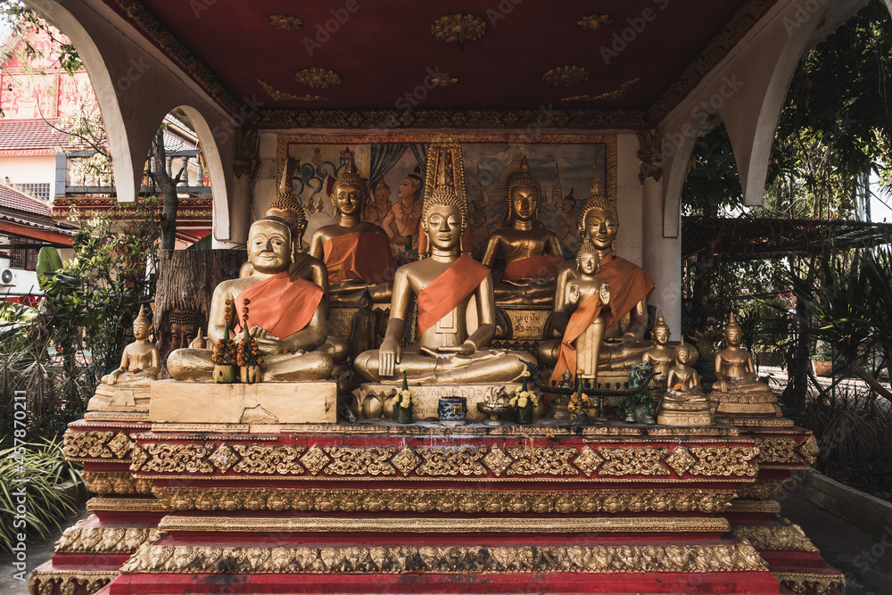 Statues of golden buddhas in the temple in Vientiane in Laos. High quality photo. 