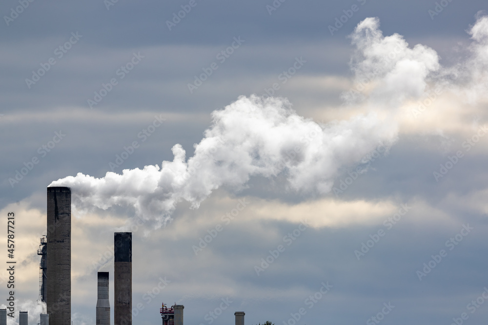 Chimneys emitting white water vapor in a chemical plant. Shot in Sweden, Scandinavia