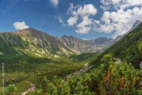 Beautiful views of the Polish High Tatras with mountain lakes and picturesque houses in the summer season