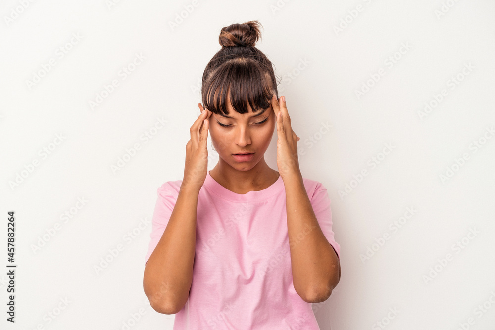 Young mixed race woman isolated on white background touching temples and having headache. Young mixed race woman isolated on white background touching temples and having headache.