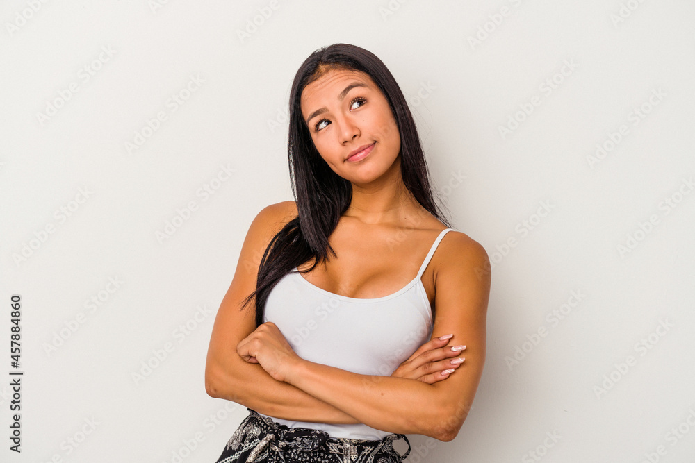 Young latin woman isolated on white background dreaming of achieving goals and purposes Young latin woman isolated on white background dreaming of achieving goals and purposes
