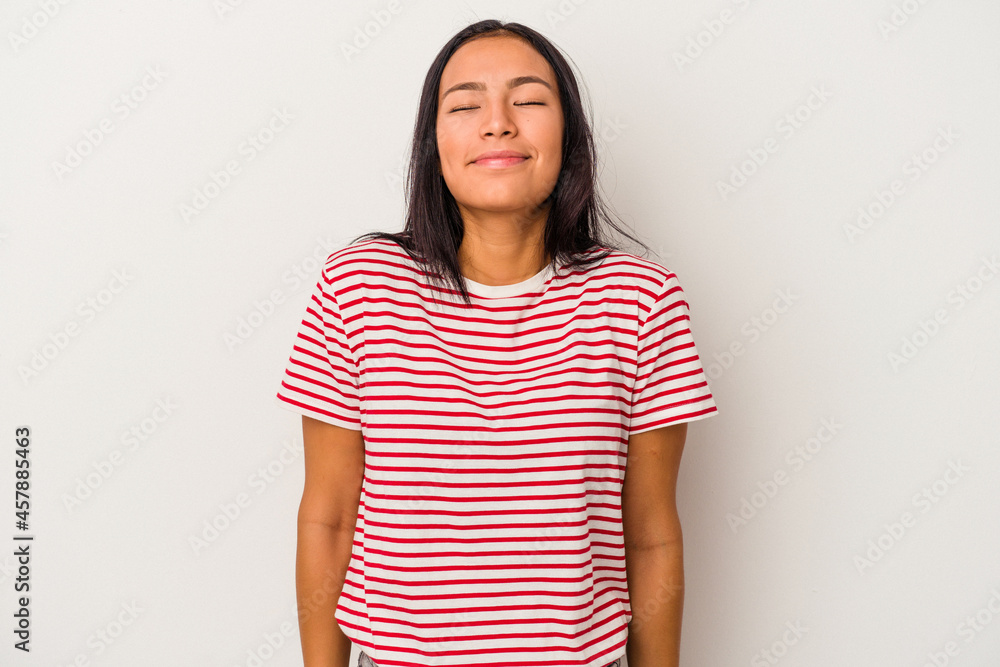 Young latin woman isolated on white background laughs and closes eyes, feels relaxed and happy. Young latin woman isolated on white background laughs and closes eyes, feels relaxed and happy.