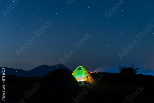 The starry sky at night on the grassland