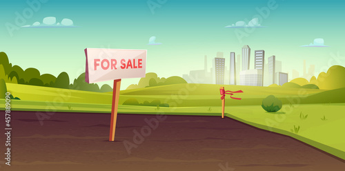 Sale of suburban land. A sign on the ground for the sale. Rural area near the city. Field or site for construction