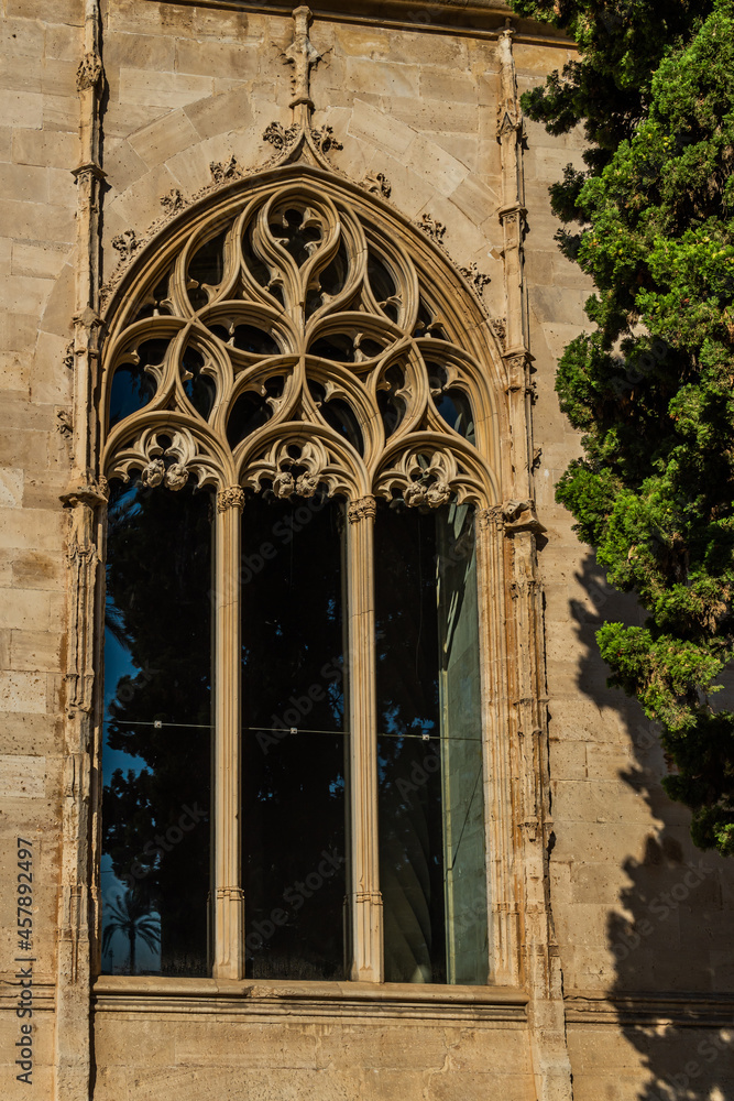 Sculped stone windows of the urban Gothic building of La Lonja in the historic center of Palma de Mallorca