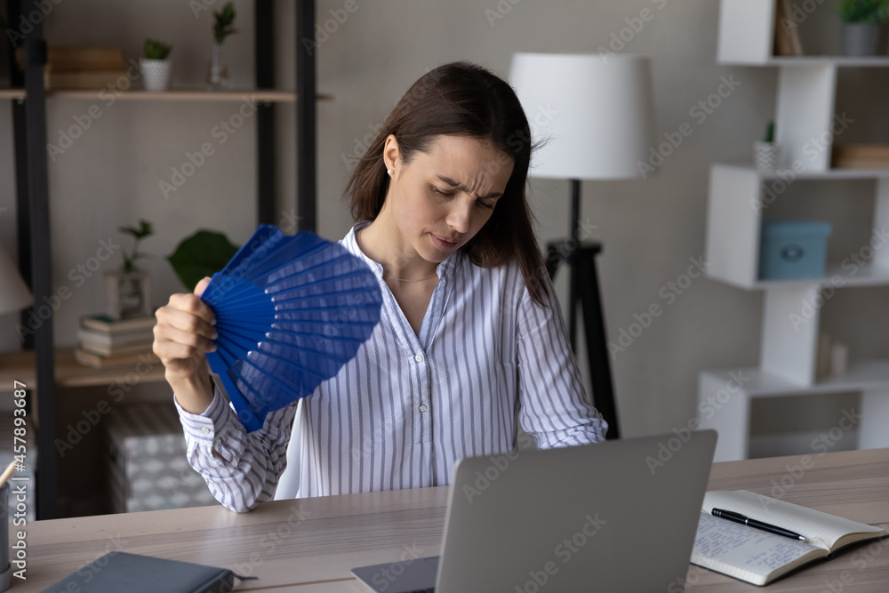 Tired Overheated Woman Waving Paper Fan Suffering From Heat Unhappy tired-overheated-woman-waving-paper-fan-suffering-from-heat-unhappy