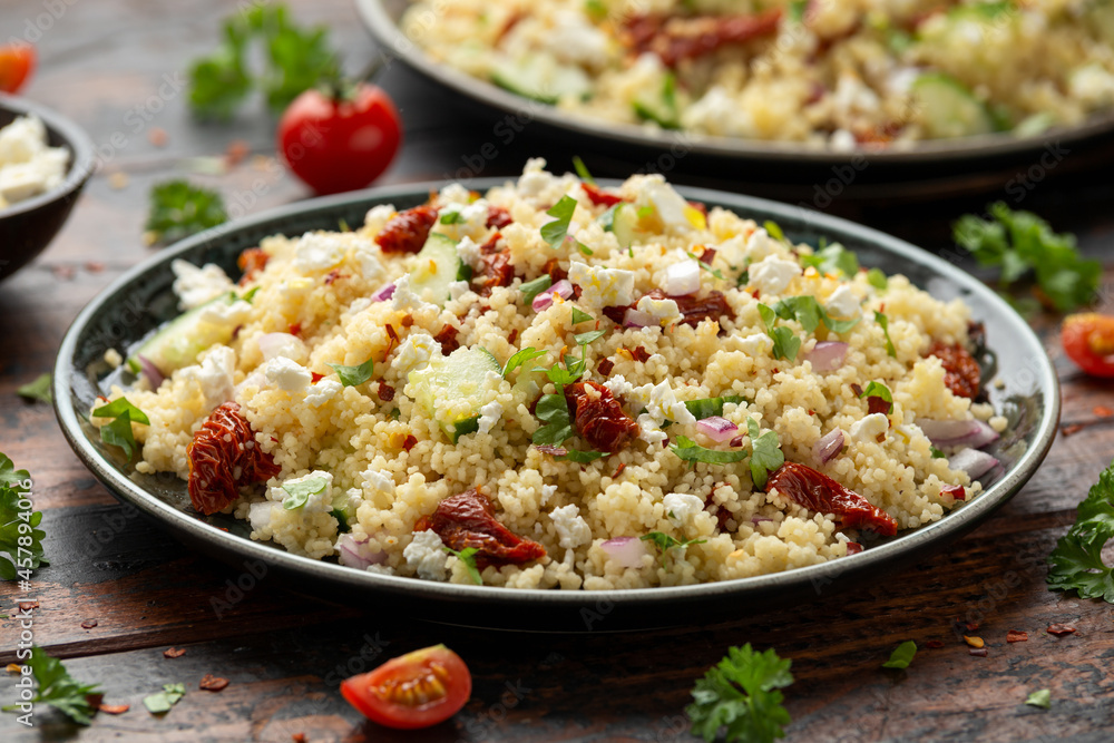 Couscous salad with sun dried tomatoes, cucumber, red onion and feta cheese. healthy food. Couscous salad with sun dried tomatoes, cucumber, red onion and feta cheese. healthy food.