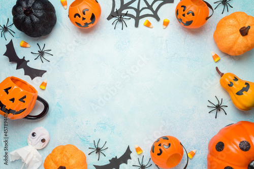 Modern Halloween frame border background  with pumpkin and decorations. Greeting card or party invitation mock up. Top view with copy space