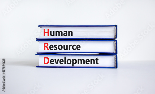 HRD, Human resource development symbol. Words HRD, Human resource development symbol on books on a beautiful white background. Business, HRD, Human resource development symbol concept. Copy space.