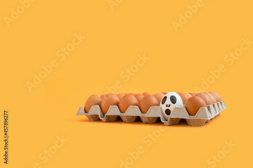 Fototapeta Naklejka Na Ścianę i Meble -  Halloween concept with eggs in paper egg tray.