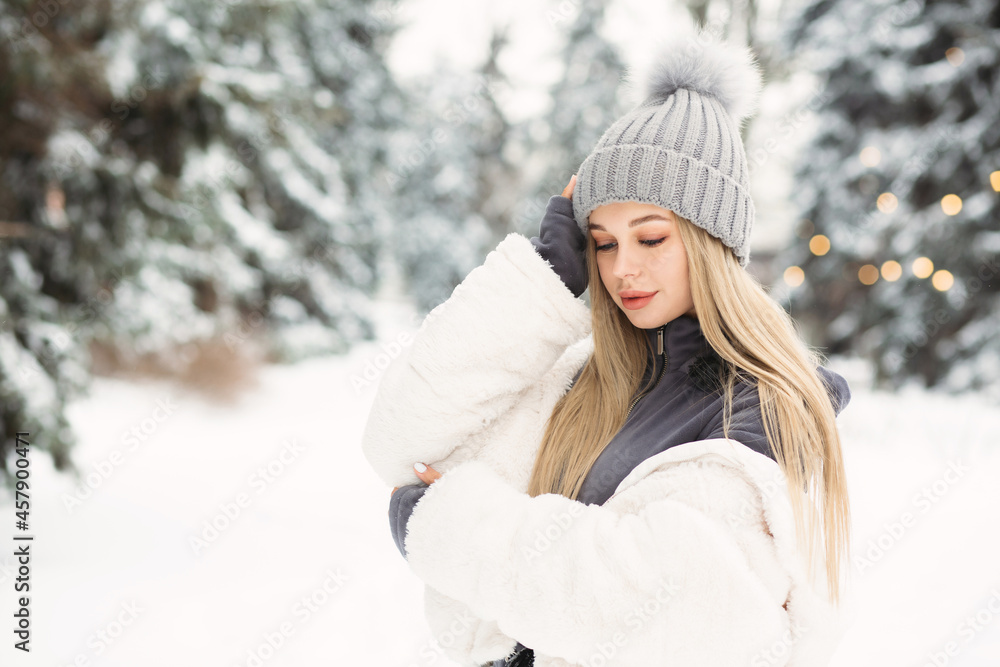 Tender lady walking in the winter forest Tender lady walking in the winter forest