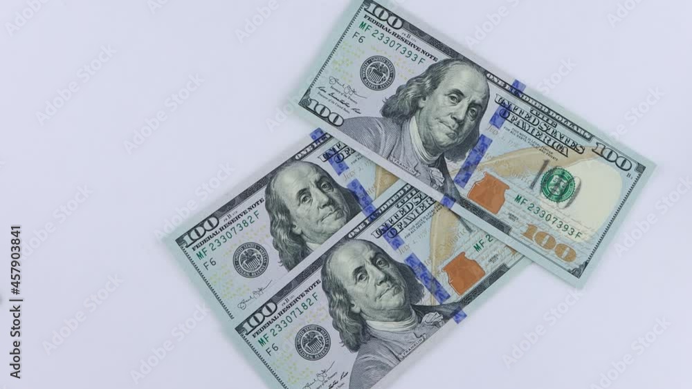 US dollars banknotes falling on the table US dollars banknotes falling on the table