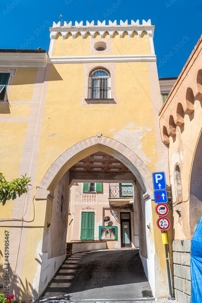 The entrance arch to the historic center of Diano Castello