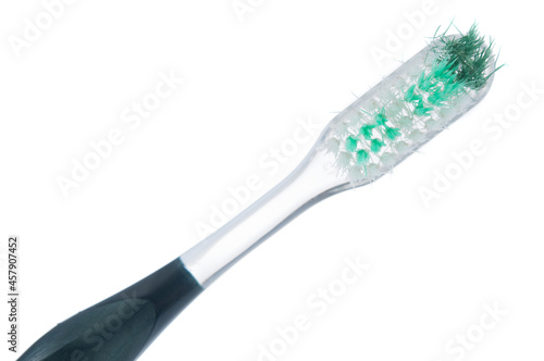 Used toothbrush close up isolated on white background