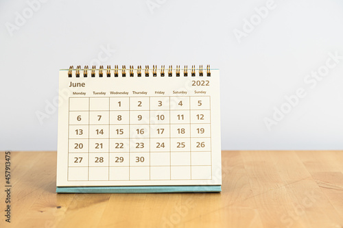 Fototapeta Naklejka Na Ścianę i Meble -  June 2022 calendar on wooden table
