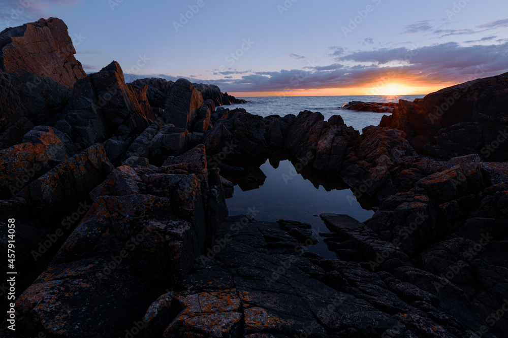 dramatic sunset over Öresund and the jagged rocks of Kullaberg