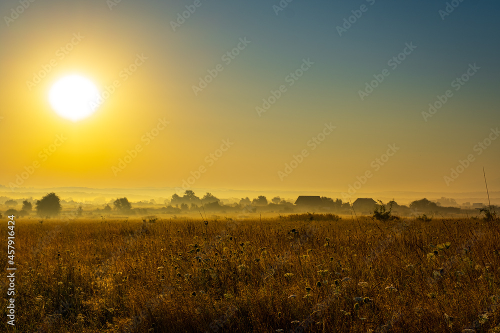 sunrise over the country field