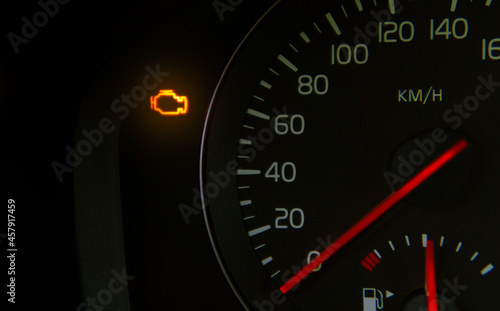 orange check engine light on the dashboard