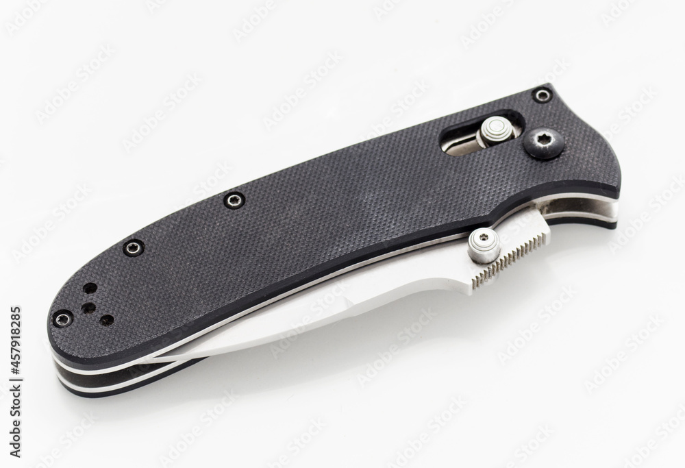 Folding knife in a folded position on a white background Folding knife in a folded position on a white background