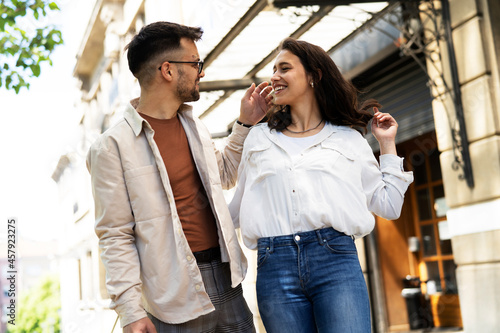 Happy young couple outdoors. Loving couple having fun together..