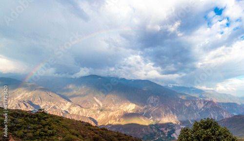 The rainbow over the Chicamocha's Canyon on a sunny and rainy afternoon photo