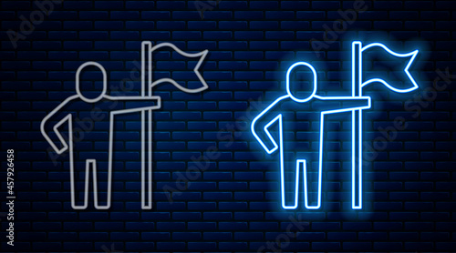 Glowing neon line Man holding flag icon isolated on brick wall background. Victory, winning and conquer adversity concept. Vector