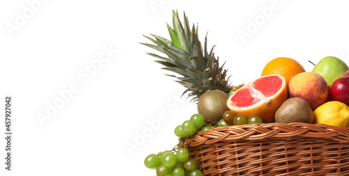 Fototapeta Naklejka Na Ścianę i Meble -  Basket with fresh fruits on white background with space for text