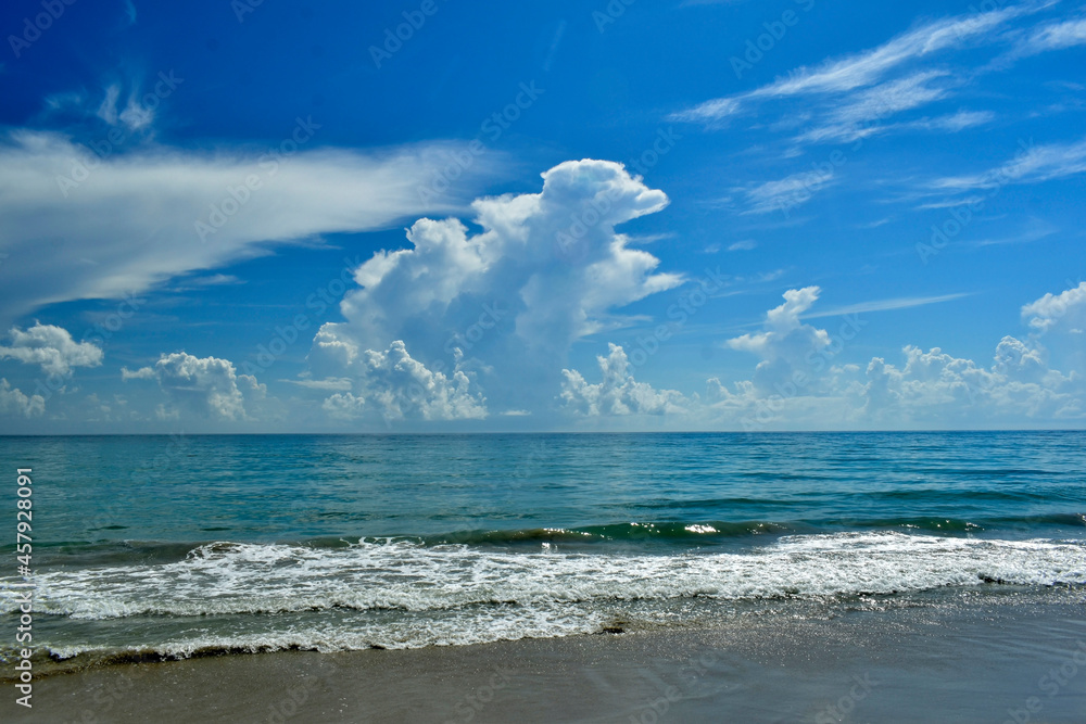 Large cumulonimbus clouds building off the Florida coast