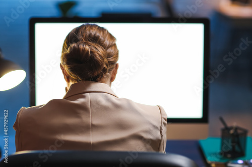 Young woman working on comp...