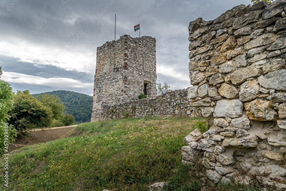 Restored medieval castle tower with moat at Essegvar Band in Veszprem county Hungary