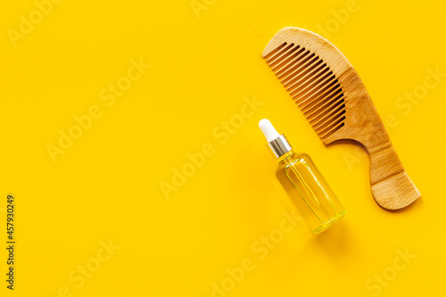 Herbal hair oil for treatment with wooden hair comb