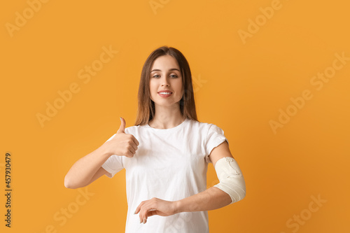 Young woman with bandaged a...