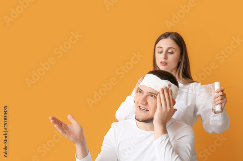 Doctor applying bandage ont...