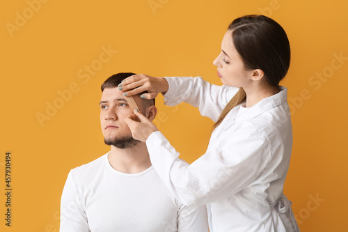 Doctor applying plaster ont...